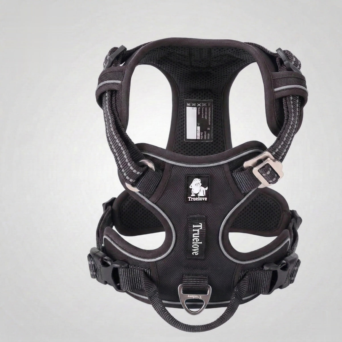 DogLove Pro No Pull dog harness in black, front view showing the front leash attachment, padded chest piece and reflective stitching