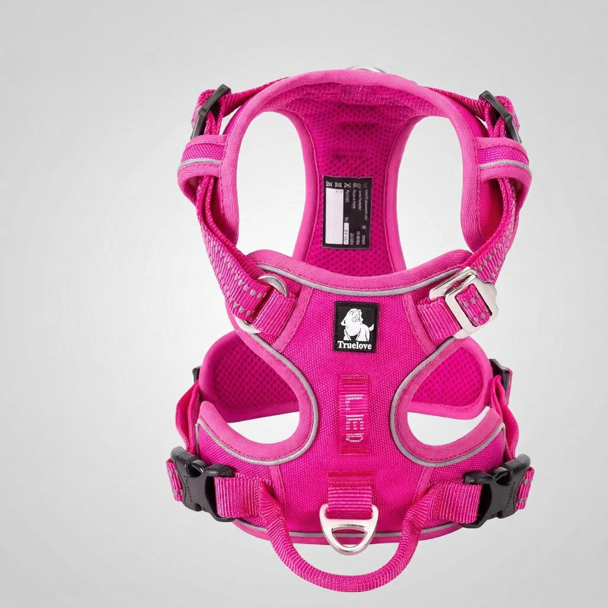 DogLove Pro No Pull dog harness in electric pink, front view showing the padded chest panel, reflective trim and multiple adjustment points